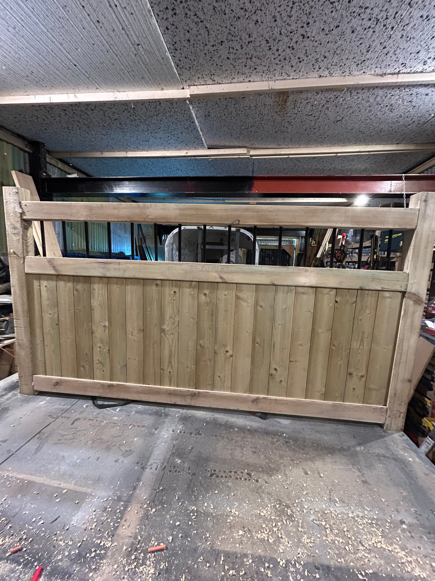 Wooden Garden and driveway gates with metal bar decoration