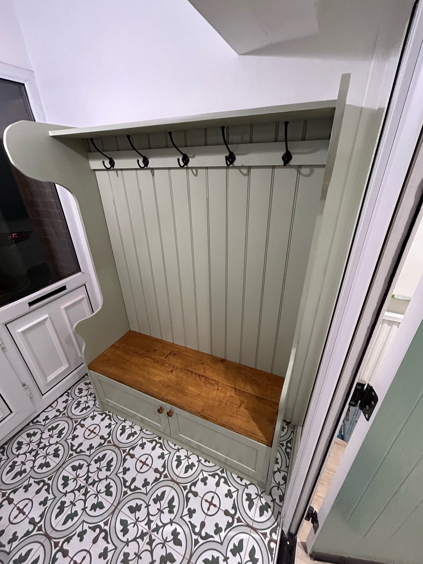 Hallway coat unit with storage cupboard and seat