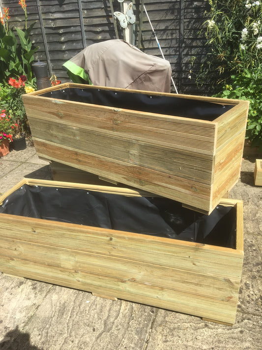 Large wooden trough planter