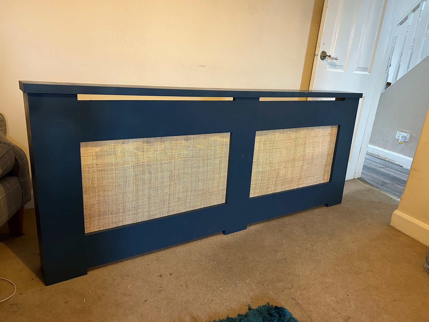 Painted radiator cover with rattan panels