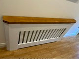 Painted radiator cover with wooden top and mitered corner